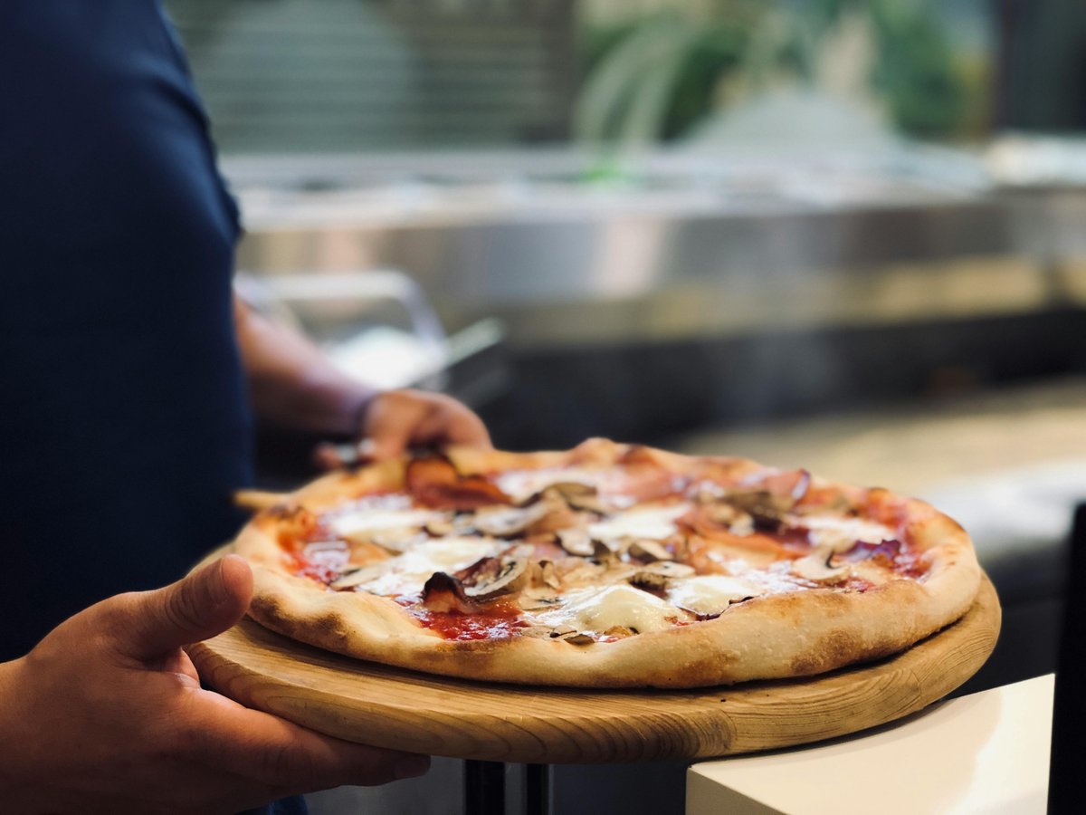 Freshly baked handcrafted pizza from Pizza Dojo workshop in Kolkata